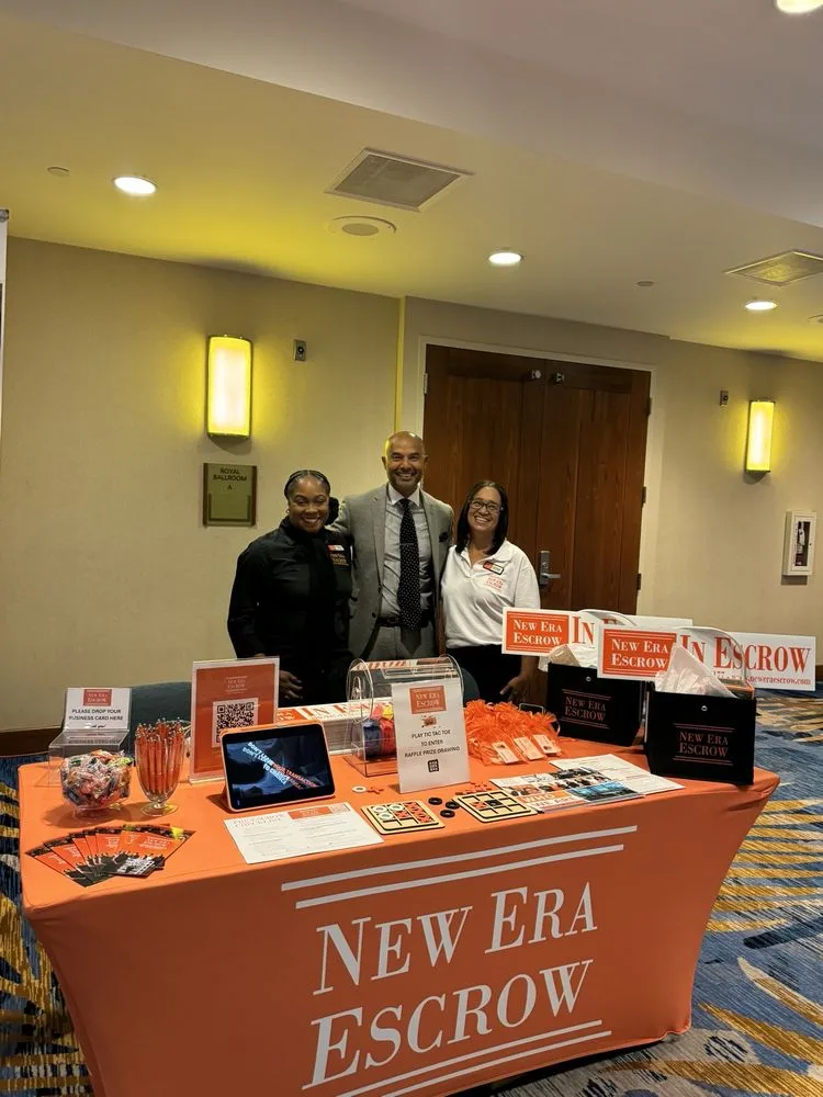 New Era Escrow team welcoming visitors at a community event