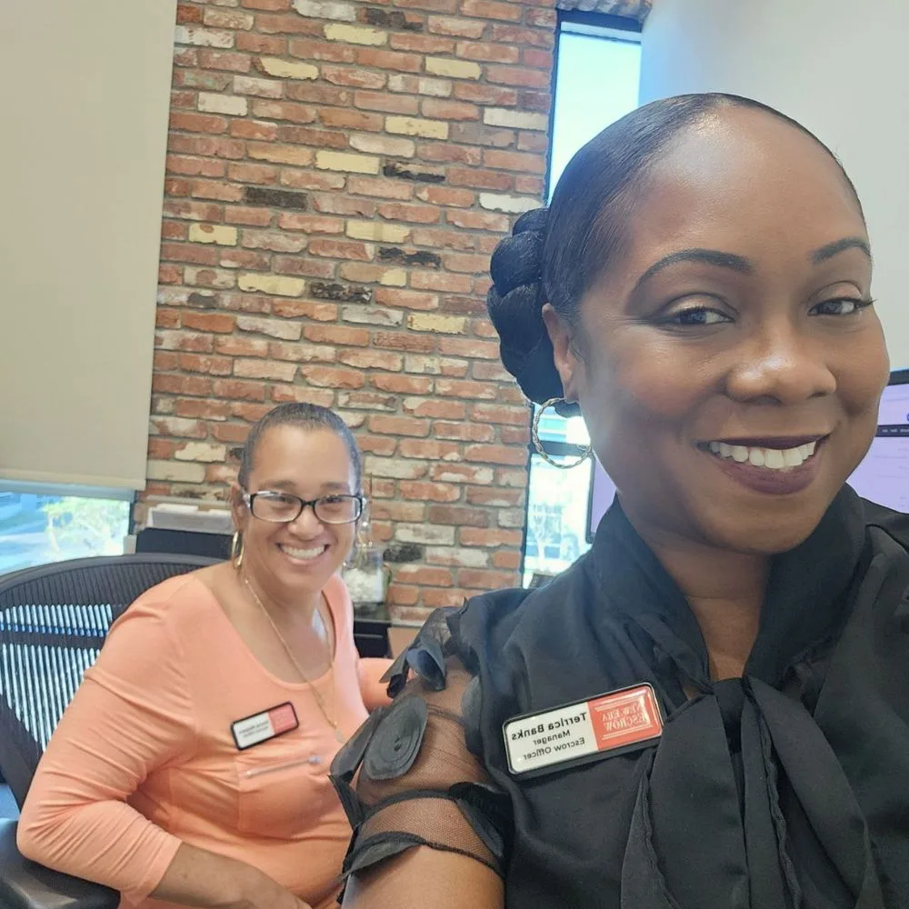 New Era Escrow team members in the office
